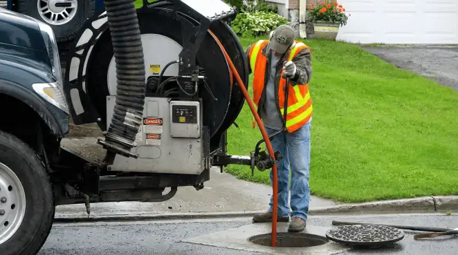 Technician using specialized drainage equipment for sewer line cleaning and foundation protection in Buffalo, NY