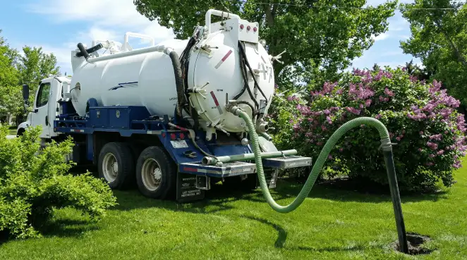 Professional vacuum truck performing residential drainage and septic maintenance in Buffalo, NY